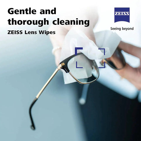 Person cleaning glasses with ZEISS Pre-Moistened Lens Cleaning Wipes 200 Count For Glasses And Sunglasses