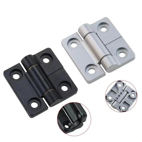 Angled view of two zinc alloy torque square damper hinges with random stop; matte black and silver finishes.