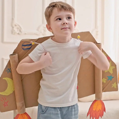 Child playing with cardboard rocket costume from 180 Piece Kids Screw Kit With 90 Screws And 90 Screw Plus Pieces.