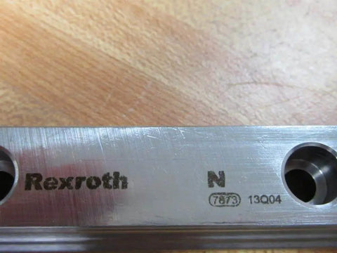 Close-up of Single guide rail R160520431 660.00 mm precision profile showing stamped markings on hardened steel for CNC use.