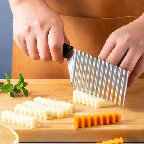 Person using Crinkle Cut Fry Cutter Set Stainless Steel Wavy Blade 2 Piece Slicer for Potatoes on wooden board