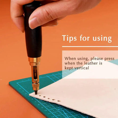 Using Adjustable Screw Hole Punch Tool With Black Wooden Handle For Bookbinding And Leather Craft on paper with tips shown