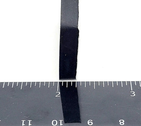 Side view of Rectangle Silicone Rubber Bumper Feet One And One Half Inch By One Inch Three Sixteenth Inch Thick with ruler for size reference