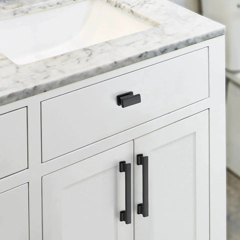 Matte Black Cabinet Knobs Set 10 Pack Durable Zinc Alloy Single Hole Cabinet Handles installed on white kitchen cabinets