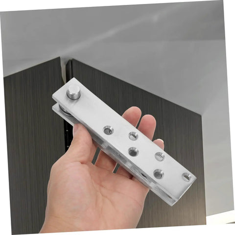 Person holding a 360 Degree Stainless Steel Heavy Duty Pivot Hinge For Hidden Doors And Secret Bookcase Doors Concealed Upper And Lower Hinges System