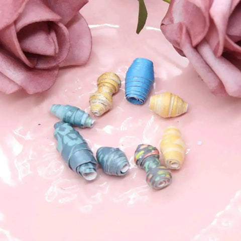 Colorful paper beads made with Paper Beads Maker Die Cutting Dies And Stencil Set for DIY scrapbooking and craft projects.