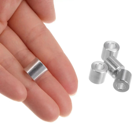 Hand holding Aluminum Spacer Set 5mm Bore 10mm Outer Diameter 10mm Length 10 Pieces Standoff Bushing For M5 Screws Bolts And Rods