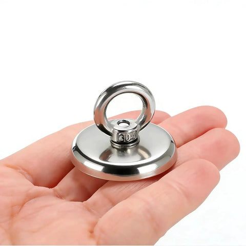 Hand holding a single neodymium fishing magnet from Six Pack Neodymium Fishing Magnets 100 Lb Pull For River Retrieval