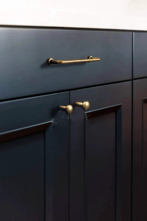 6 Pack 5 Inch Center To Center Antique Brass Cabinet Bar Pulls Hand Finished Artisan Patina Vintage Drawer Handles installed on dark cabinet