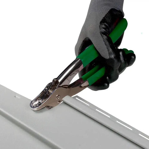 Hand using Vinyl And Aluminum SnapLock Punch For Finishing Siding And Skirting With Locking Tabs High Projection Design on vinyl panel
