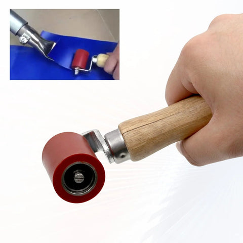 Front view of seam roller tool with wooden handle and red silicone 40mm wheel.