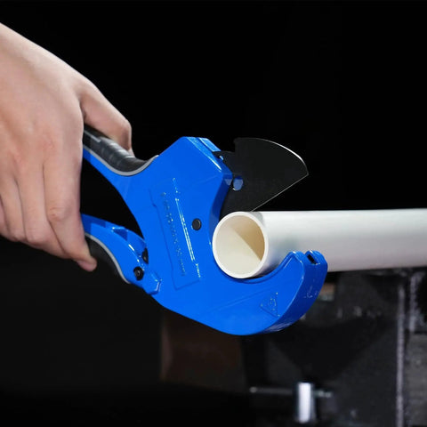 Beast Mode Heavy Duty Ratchet Pipe Cutter For PEX PVC PPR Hoses Up To 2 1/2 Inches cutting white pipe on black background