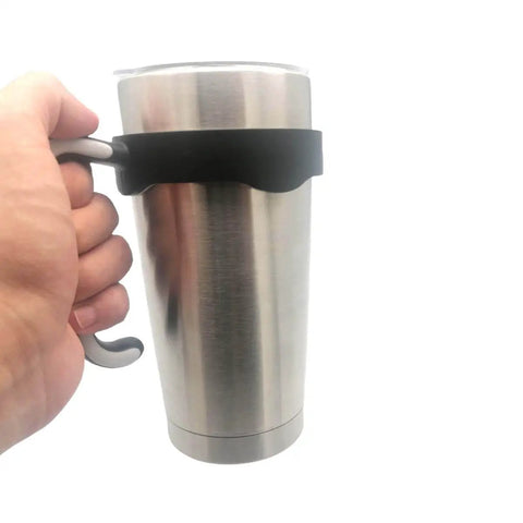 Hand holding stainless steel tumbler with No Slip 20 Oz Tumbler Handle For Vacuum Insulated Mugs, Easy Grip Travel Cup Holder in black.