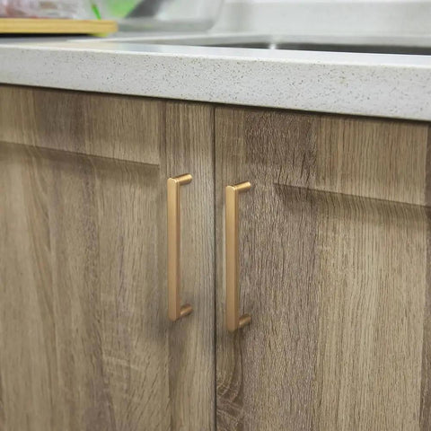 5 Inch Champagne Bronze Cabinet Pull Handles 6 Pack With Grooved Texture And Non Slip Grip For Farmhouse And Industrial Cabinetry Decorative Hardware For Cabinets And Dressers installed on wooden kitchen cabinets.
