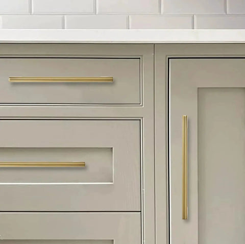 Six Pack 6 Inch Center To Center Brushed Brass Cabinet Pulls installed on kitchen drawers and cabinets showing antique style hardware.