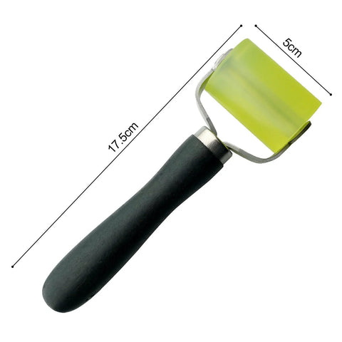 Car sound deadener roller tool with black handle and yellow rectangular 2-inch roller head
