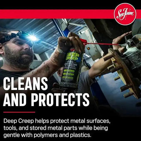 Worker using Deep Creep spray to clean and protect metal surfaces and tools in a workshop environment.