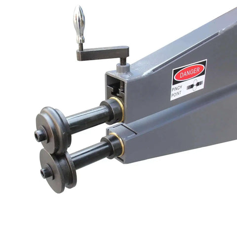 Close-up of the 36 Inch Throat Electric Bead Roller for Sheet Metal showing the rollers and warning label, a heavy-duty fabrication tool.