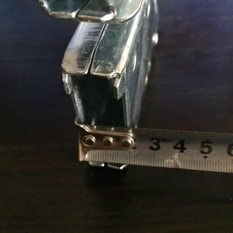 Close-up of Multifunctional Folding Ladder Hinge Set showing steel material and measuring tape for size reference, stable load bearing