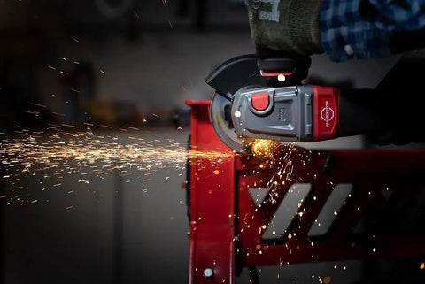 Aggressive Four And A Half Inch Cut Off Wheels Pack Of Five For Angle Grinders General Purpose Cutting Discs With Norton Aluminum Oxide Grain And Proprietary Bond For Long Life And More Cuts Per Wheel When Cutting Metal And Stainless Steel displayed in use cutting metal with sparks flying.
