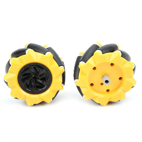 Front and rear view of yellow and black rubber-coated Mecanum wheels from Mecanum Wheel Kit For DIY Smart Cars And Small Robots.