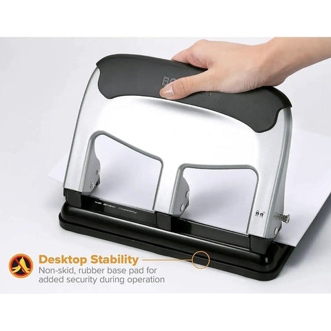 Hand using EZ Squeeze Heavy Duty 3 Hole Punch With 40 Sheet Capacity, All Metal Build, Fifty Percent Less Force, Anti Slip Rubber Base
