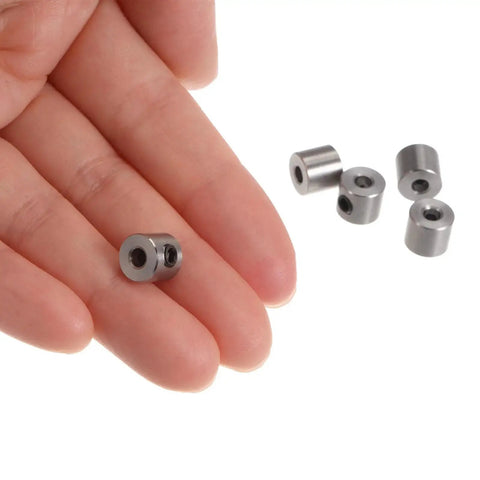 10 Pack 3mm Shaft Collar Set Screws In Stainless Steel 304, 8mm Outside Diameter, 7mm Thick, shown in hand for scale