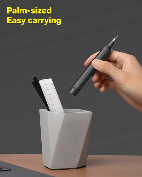 Person holding Compact 24 In 1 Mini Screwdriver Set With Magnetic Torx Bits Eyeglass Repair Kit and EDC Pen Screwdriver.