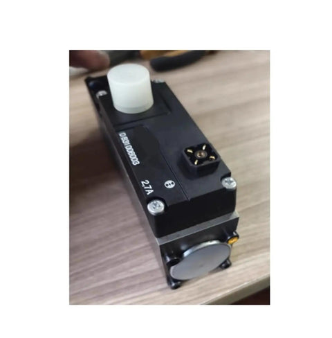 Angled front view of black electric proportional valve with white top knob and connector, 2.7A automotive part.