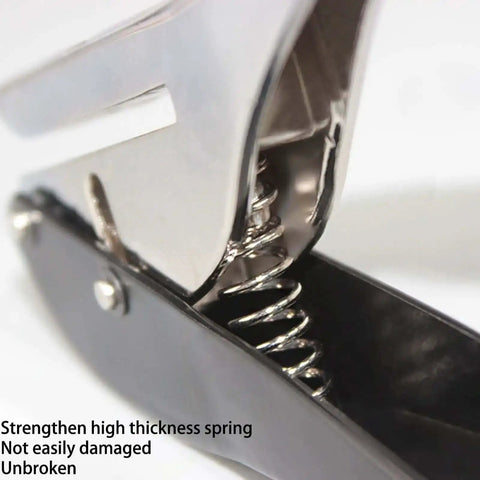 Close-up of Pro Grade Heavy Duty Single Hole Punch showing metal spring mechanism and ergonomic grip handle.