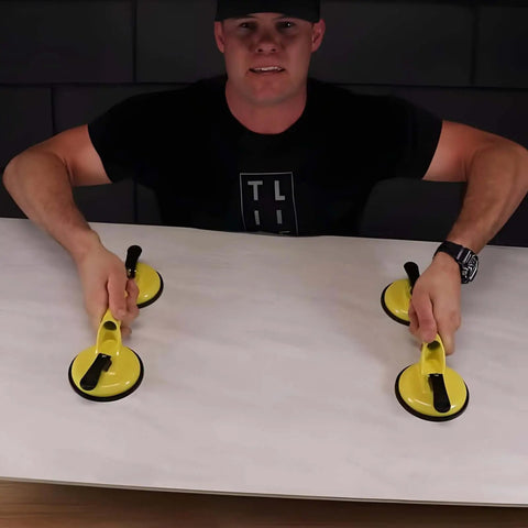 Person using Heavy Duty Aluminum Suction Cups With Vacuum Handle Glass And Tile Lifter For Lifting Large Glass Tile Marble Floor Ergonomic Grip