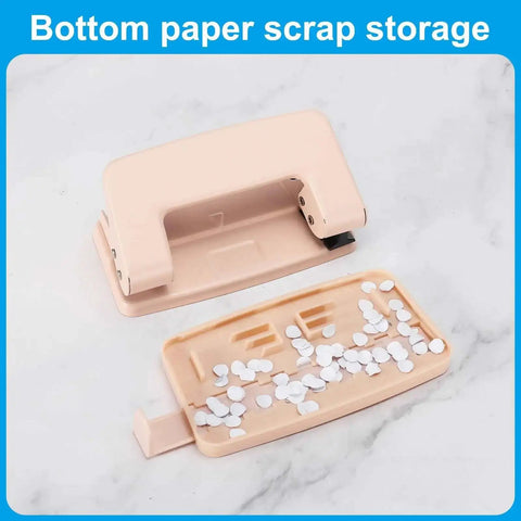 Beefy 6mm Two Hole Punch with paper scrap tray, ergonomic design for scrapbooking, DIY tags, and tickets in a pink finish.