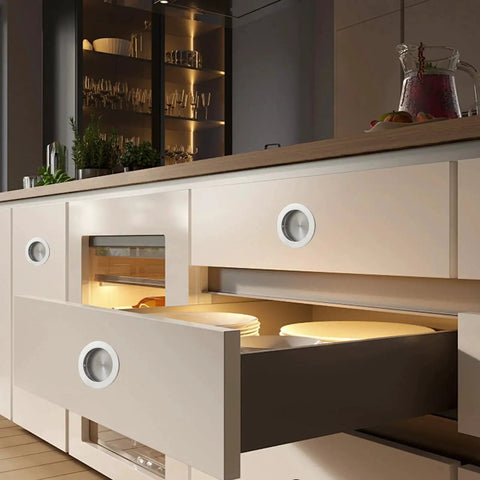 Recessed Pocket Door Pull Handles 2 3 4 Inch Round Finger Flush Pulls installed on modern kitchen cabinets, brushed 304 stainless steel.