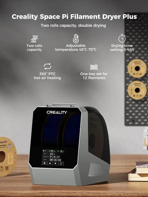 Creality Space Pi Filament Dryer Plus with dual roll capacity and LCD touch screen, featuring 360° PTC hot-air heating, on a wooden table.
