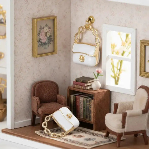 Miniature 1:12 scale white purse with chain for dolls on shelf in dollhouse, part of Three Pack Mini Handbag Set For Dollhouse Decor.