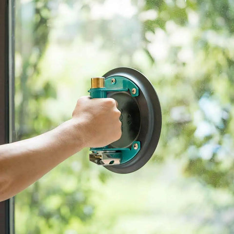 8 Inch Glass Vacuum Suction Cup With Metal Handle And Brass Pump in use on flat glass surface