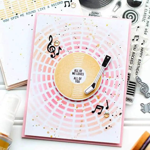 Music CD Style Clear Stamp And Die Set For Card Making And Scrapbooking featuring a vinyl record design on a DIY card with musical notes.