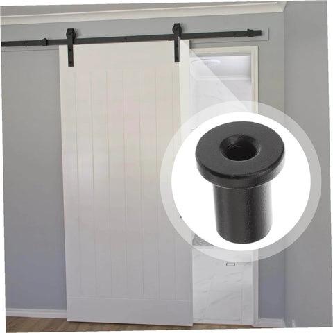 Five Piece Barn Door Track Spacers Kit Wall Mount Connectors For Rustic Basement Sliding Doors Black Replacement Pro Grade Hardware To Keep Doors Aligned Stable Mounting And Easy Install showing close-up of black spacer and installed sliding door.