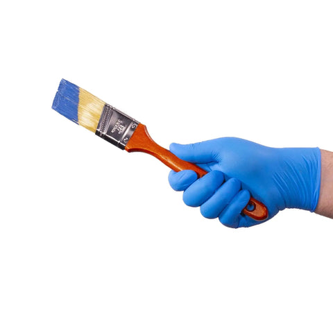 Hand wearing Industrial Blue Nitrile Gloves 100 Count Box 3 Mil XX Large Textured Latex Free holding a paintbrush