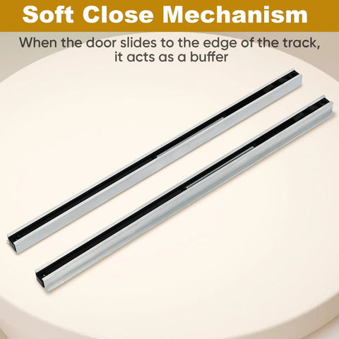 Close-up of soft close mechanism for Hidden Barn Door Hardware Kit With 48 Inch Track System Heavy Duty Quiet Roll Interior Door Track Kit Fits One And A Quarter Inch To One And Three Quarter Inch Thick Doors And Supports Up To 176 Pounds. Silver tracks on table.