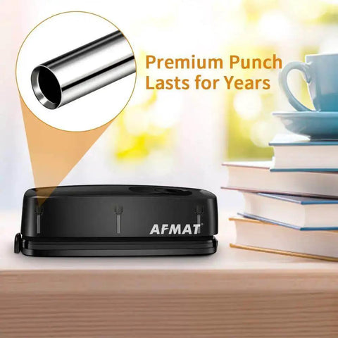 Electric 3 Hole Punch For Binders, 20 Sheet Capacity, quick start button, heavy duty design on desk with books and cup.