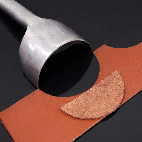 Close-up of 10 Piece Half Round Leather Punch Set cutting leather strap end, showcasing arc shaped cutter punch in use for DIY crafting.