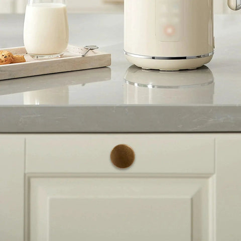 Set Of 10 Antique Brass Cabinet Knobs And Zinc Alloy Drawer Pulls For Kitchen Cabinets And Furniture, shown on white cabinet