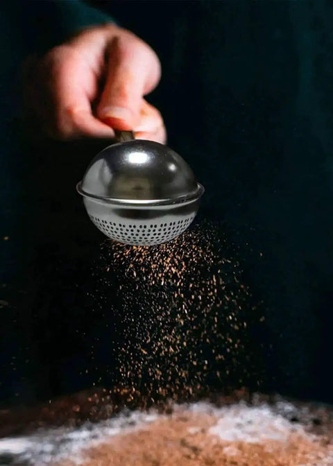 Flour Duster For Baking One Handed Operation Stainless Steel Powdered Sugar Shaker Duster in use dusting cocoa powder