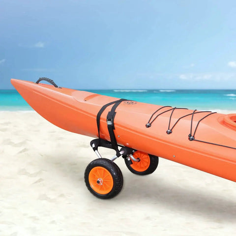 Foldable Aluminum Kayak Cart With 250 Lb Load Capacity And 10 Inch Solid Wheel Dolly transporting orange kayak on sandy beach