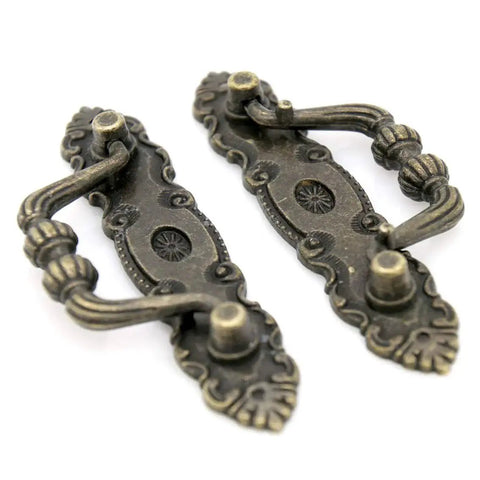 Two vintage antique brass bail pulls for drawers with distressed finish, part of Six Pack Vintage Antique Brass Bail Pulls For Drawers Cabinets Dressers Cupboards Set Featuring 4.1 Inch Length And 1.5 Inch Height Inter Hole Spacing 3.5 Inches Made From Zinc Alloy With Distressed Finish Retro Rustic Hardware set.