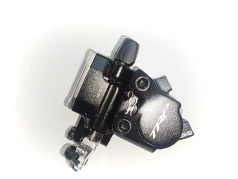 Side view of black TRP flat-mount hydraulic disc brake caliper