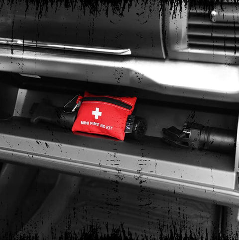 Compact 20 Piece First Aid Kit With Carabiner For Car Backpack And Travel Water Resistant Emergency Medical Kit in car dashboard