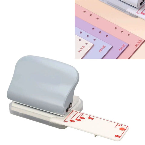 3 Hole Puncher For Loose Leaf Paper Portable Handheld Punch With Metal Build and Positioning Ruler, shown from side view with paper guides.
