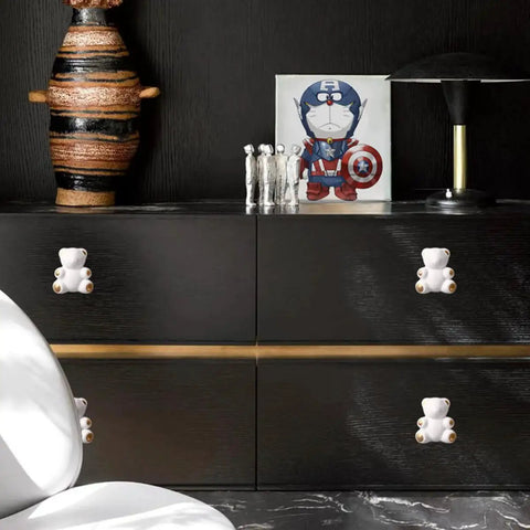 Lovely Teddy Bear Ceramic Cabinet Knobs 2 Pack on black dresser, smooth durable handles for kids room, modern furniture decor.